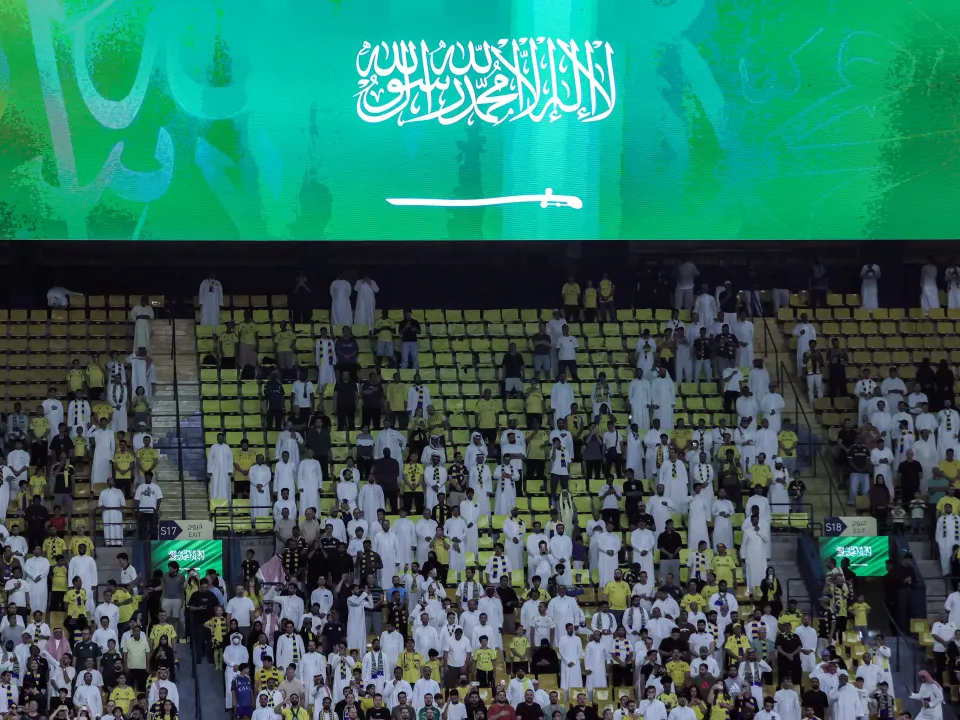 Editorial photograph illustrating Japan FA chief says Saudi security clouds 2027 Asian Cup schedule
