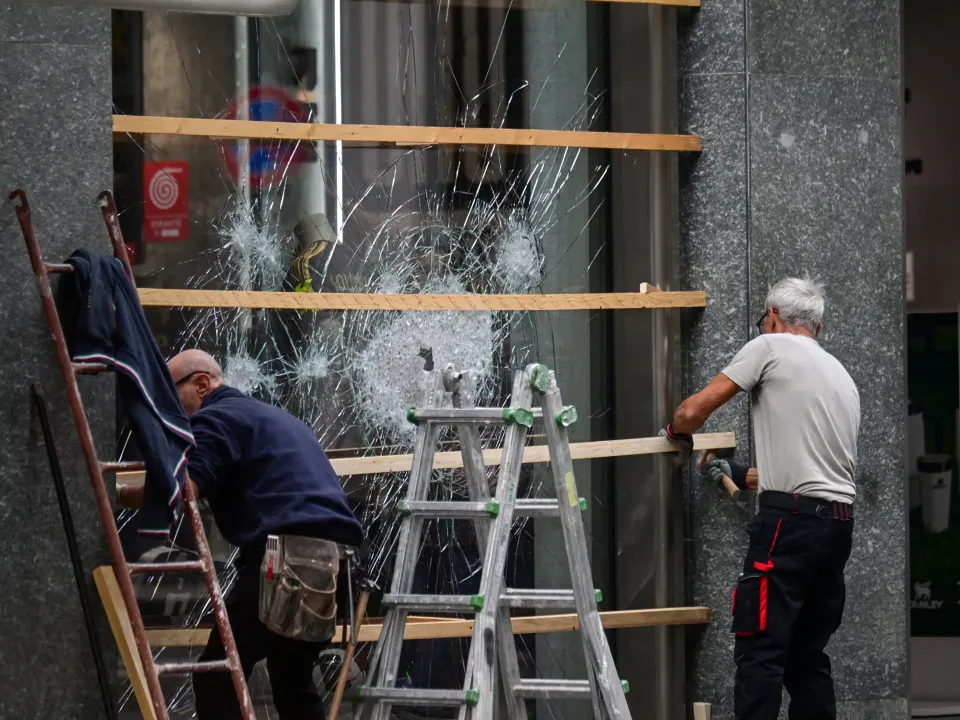 Editorial photograph illustrating Can parents be made to pay for protest damage caused by minors in France and Italy?