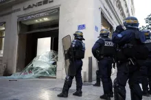 France arrests 1,800 after cost-of-living protests turn violent