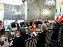 Editorial photograph illustrating Tehran talks create a regional channel as Houthi attacks continue