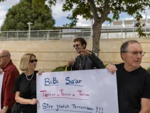 Editorial photograph illustrating Israel arrests 10 in inquiry into West Bank settler attacks on diplomats, journalist