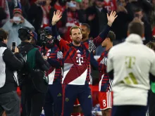 Editorial photograph illustrating Bayern rout Magdeburg as Kane is honoured and Kompany leaves hospital