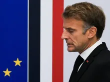 Editorial photograph illustrating Macron vows accountability after violence mars France protests