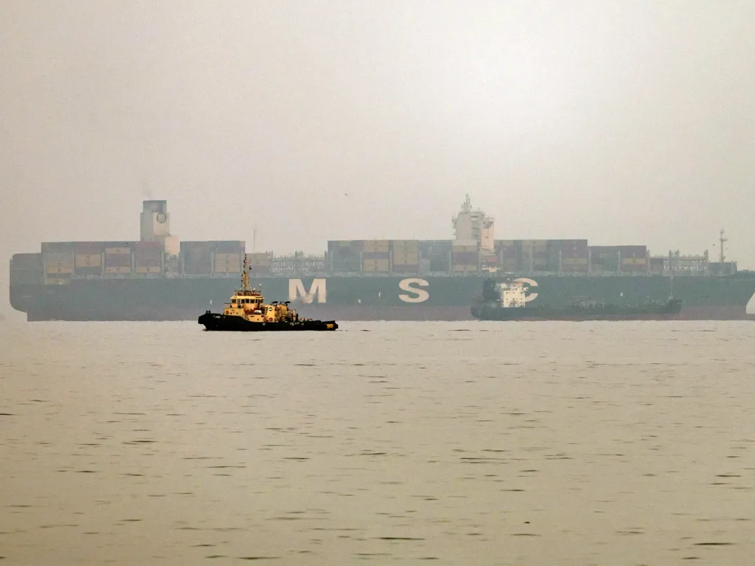 Editorial photograph illustrating US and Iran Both Claim Control of Strait of Hormuz Amid Vessel Attacks