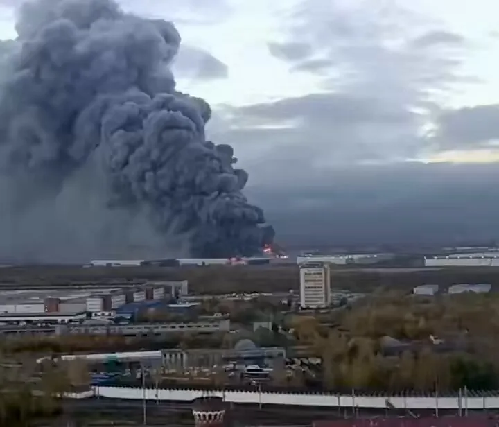 Editorial photograph illustrating Fire burns for hours at Ozon logistics center after St. Petersburg drone attack